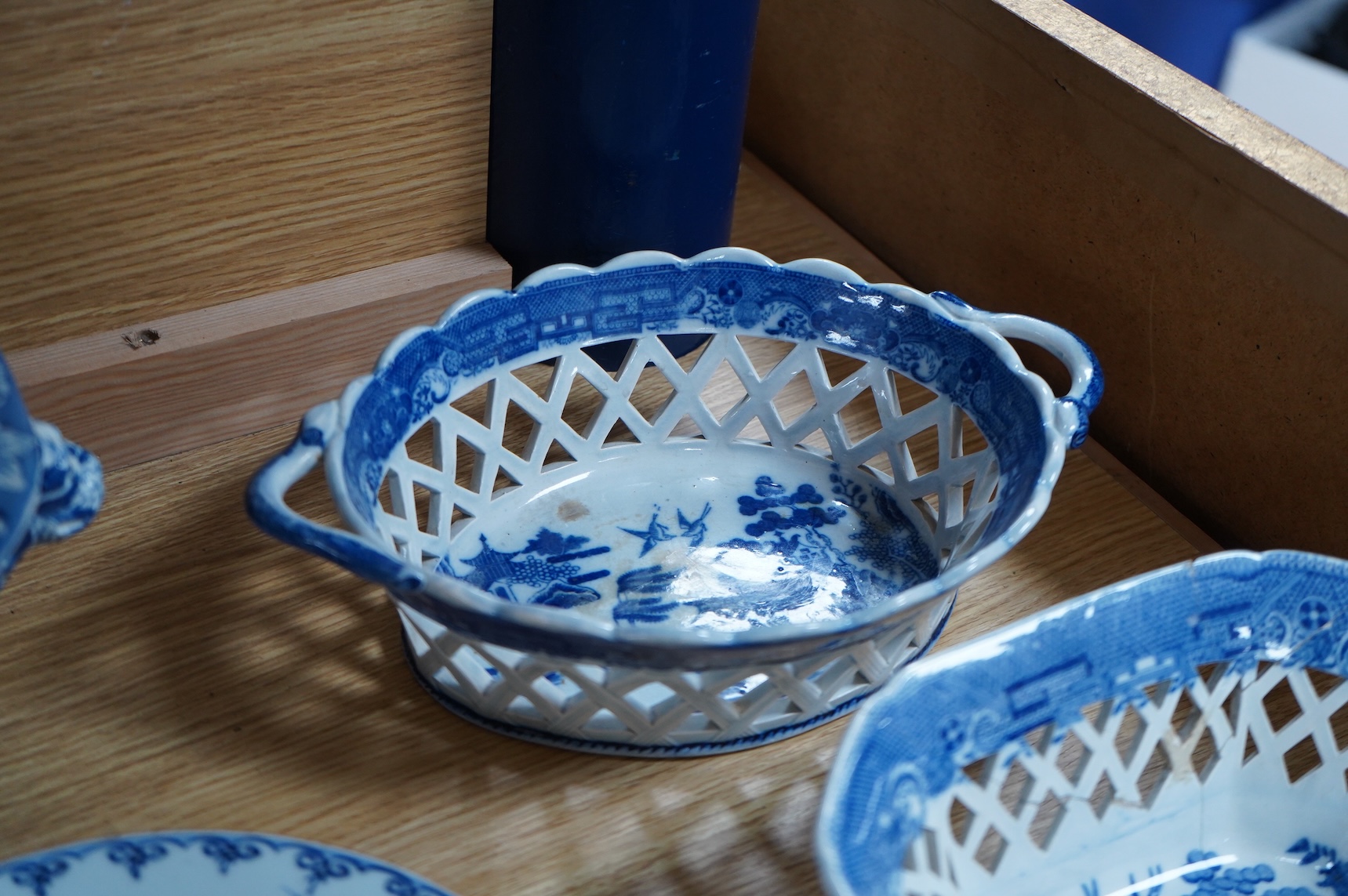A group of Victorian blue-printed dinner wares, including a Chinese blue and white dish and a Wade bird (13).